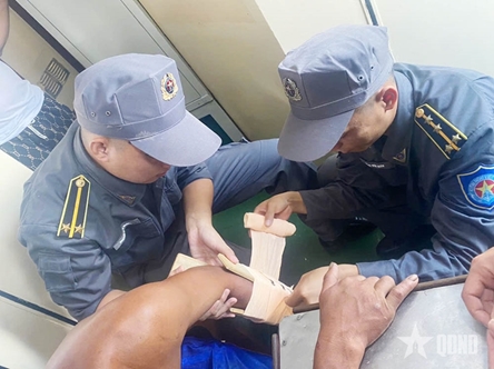 Fisheries surveillance ship rescues injured fisherman at sea